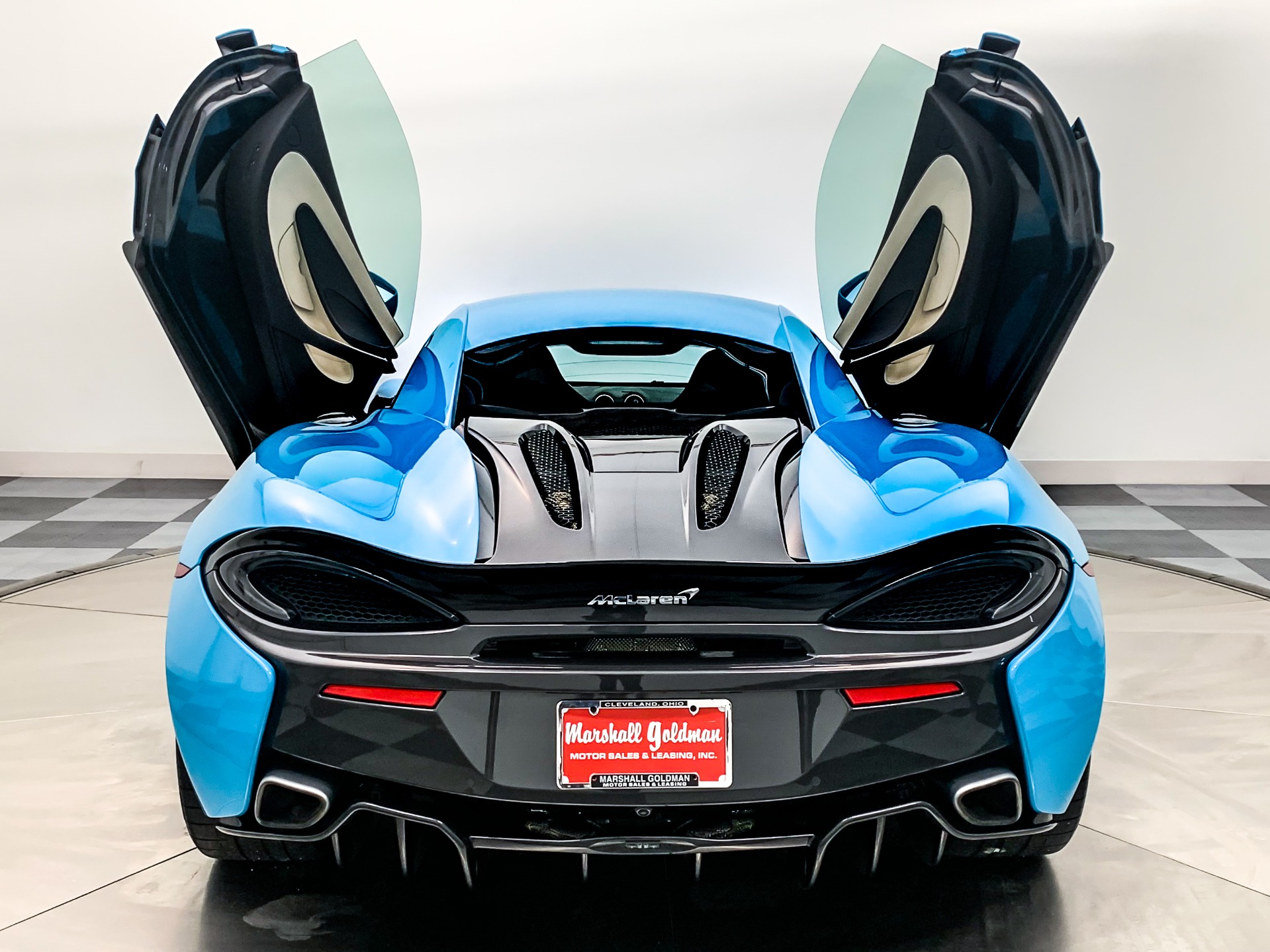 Curacao Blue McLaren 570S with Jet Black with Almond White Insert