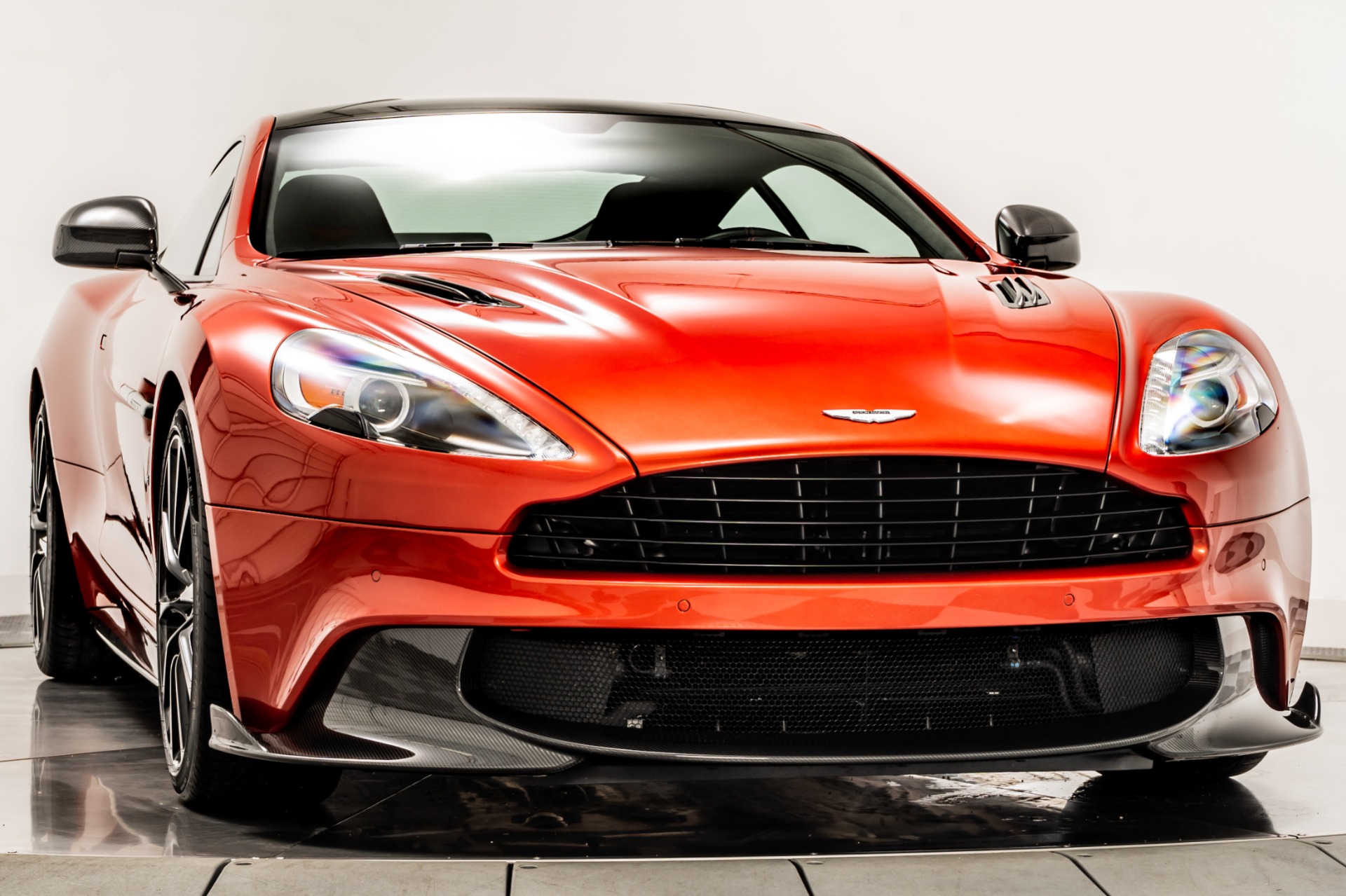 Fiamma Red Aston Martin Vanquish S with Metallic Black Interior
