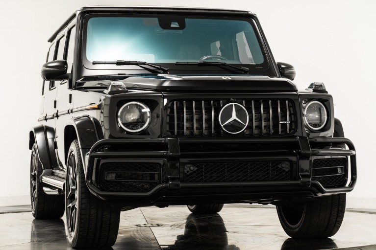 Obsidian Black Metallic Mercedes-Benz G63 AMG with Black w/ Red