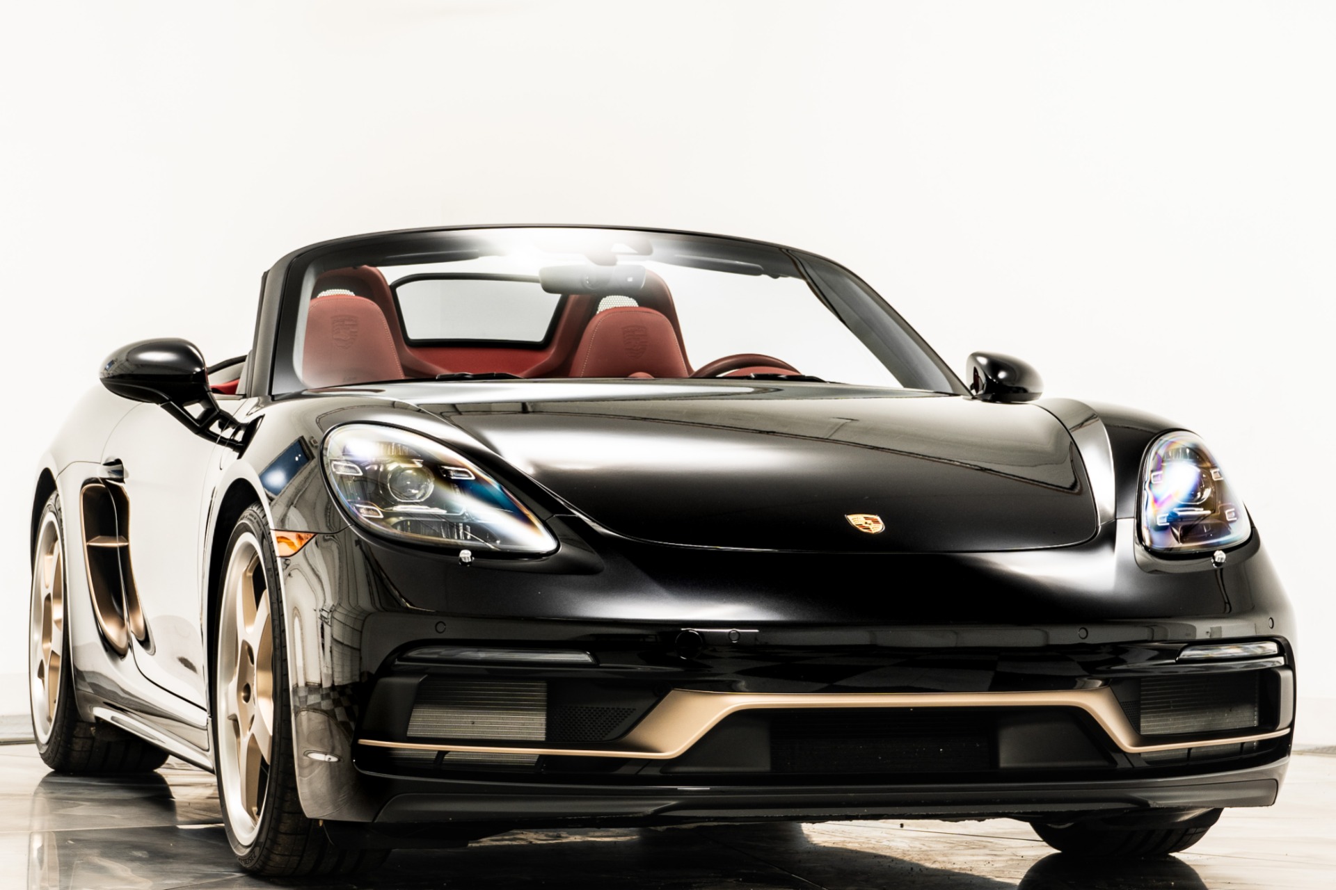 Jet Black Metallic Porsche 718 Boxster 25 Years with Bordeaux Red